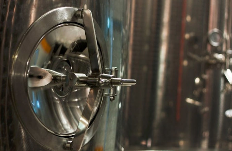 wine fermentation tank's door at Oinodos Wines facilities